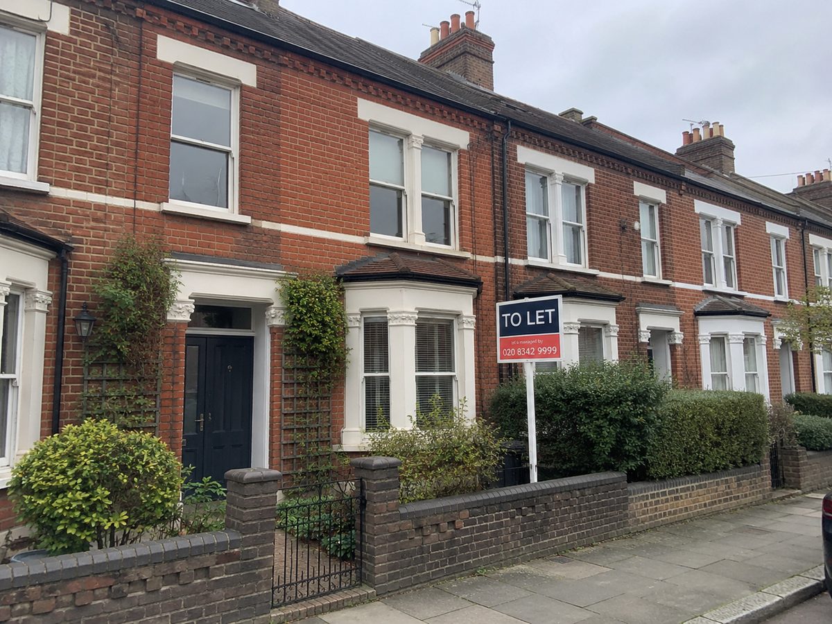 A UK terraced house with a To Let board outside